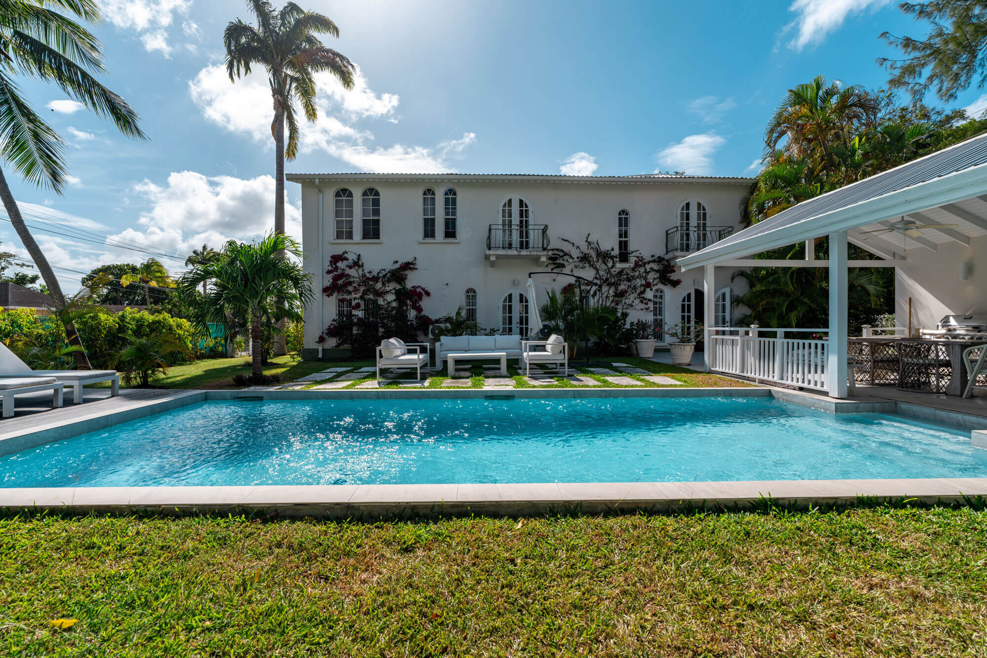 The swimming pool and garden at The Bridge residence